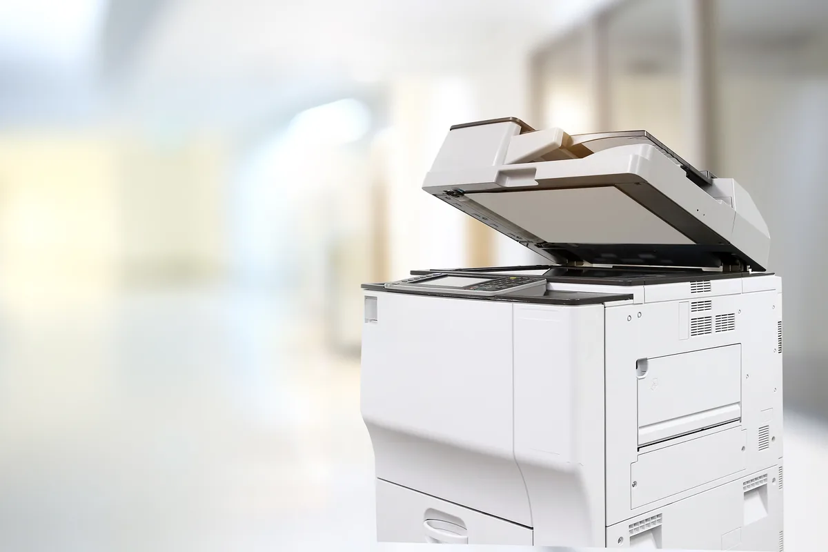 White multifunction photocopier in a bright office